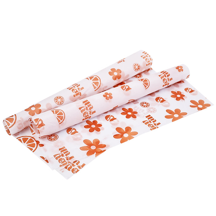 White wrapping paper with multiple patterns and orange printing