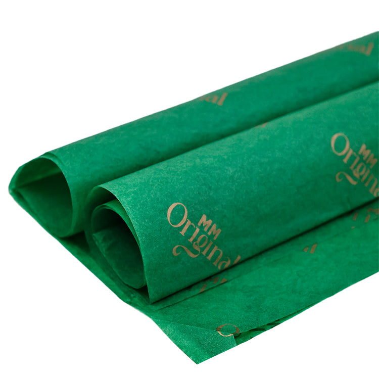 Green wrapping paper pattern with gold foil printing