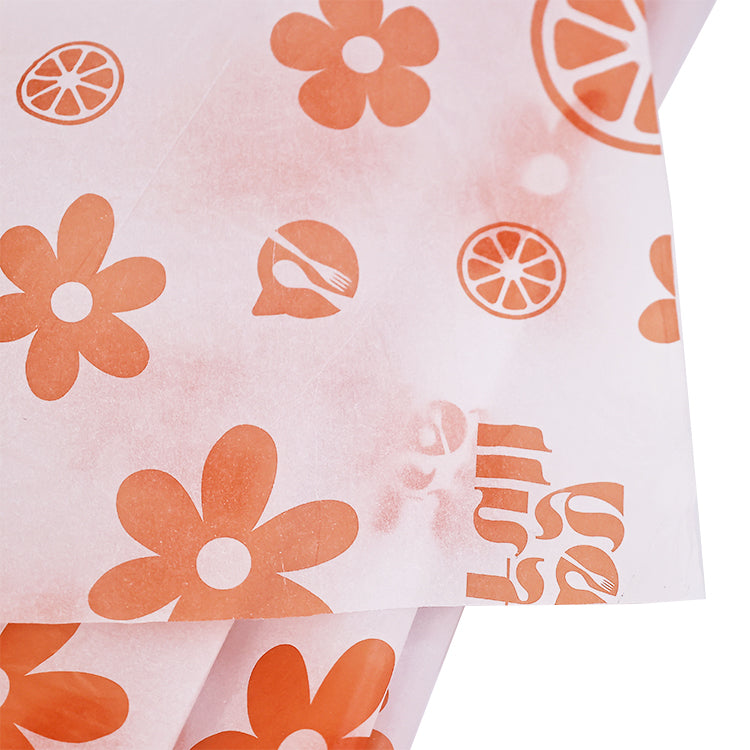 White wrapping paper with multiple patterns and orange printing