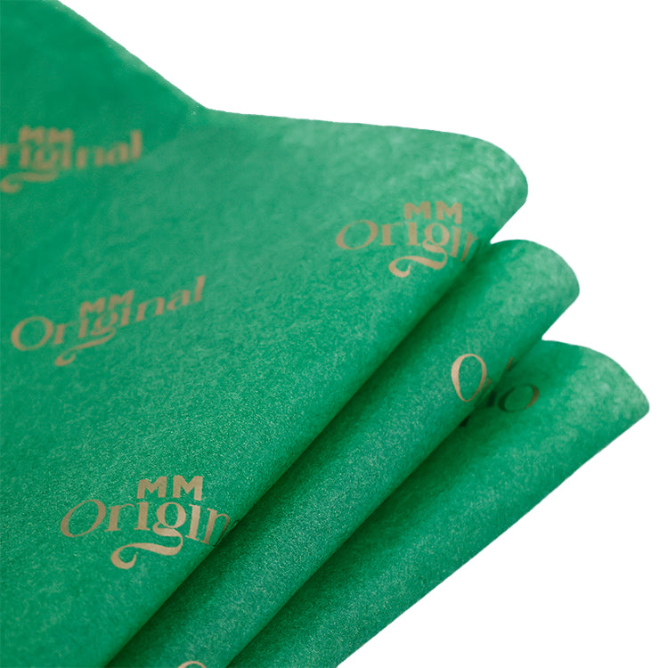 Green wrapping paper pattern with gold foil printing