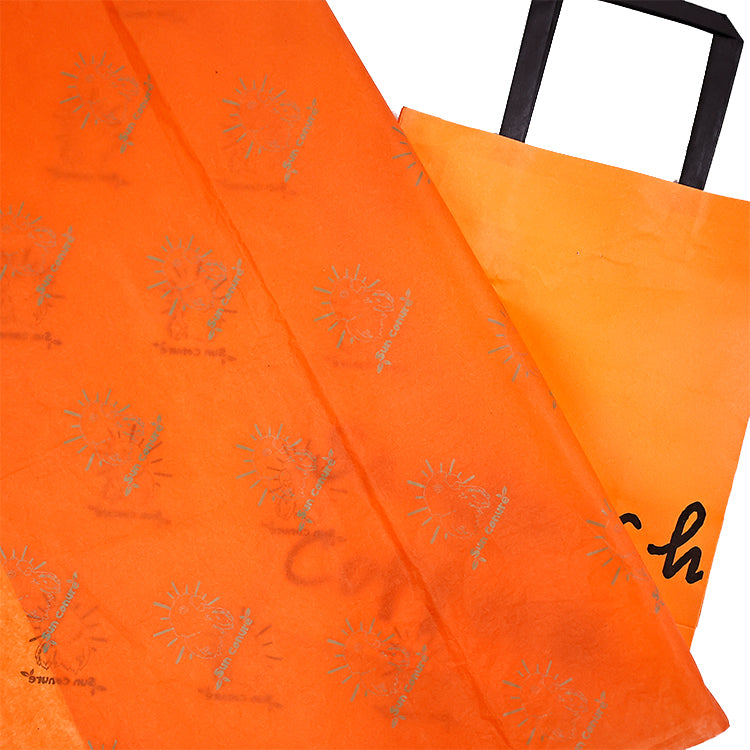 Orange wrapping paper pattern printed with gold