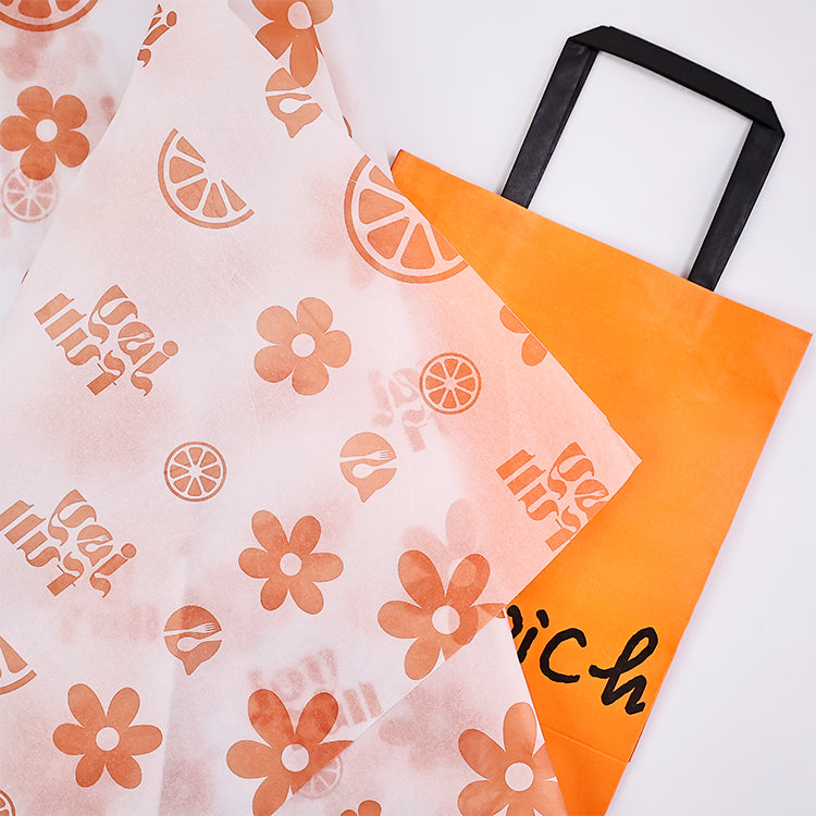 White wrapping paper with multiple patterns and orange printing
