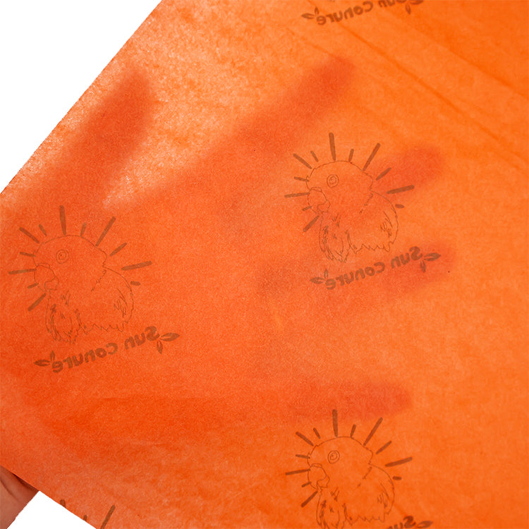 Orange wrapping paper pattern printed with gold