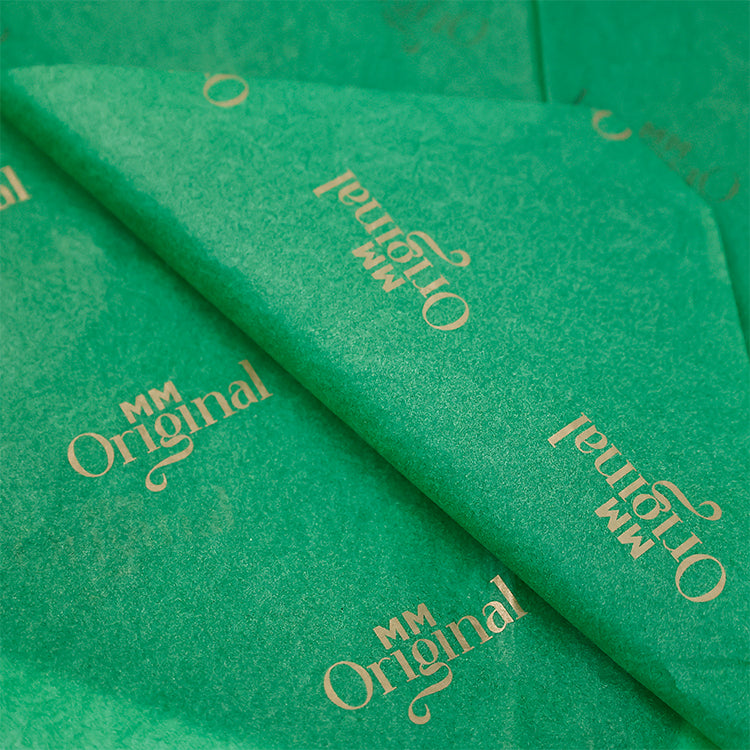 Green wrapping paper pattern with gold foil printing
