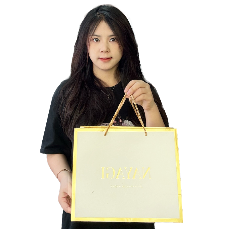 White pattern gold stamped paper bag with gold around the edges