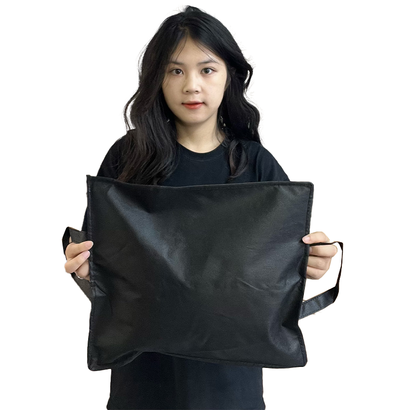 Black non-woven packaging bag with middle zipper and transparent skylight design at the bottom