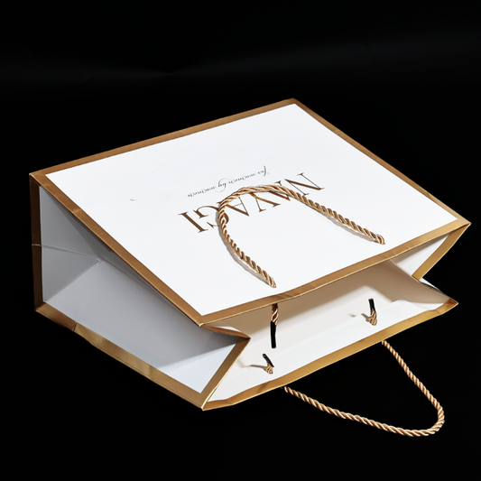 White pattern gold stamped paper bag with gold around the edges