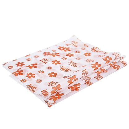White wrapping paper with multiple patterns and orange printing