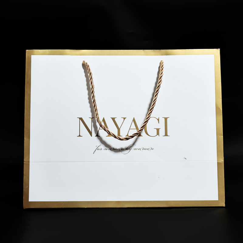 White pattern gold stamped paper bag with gold around the edges