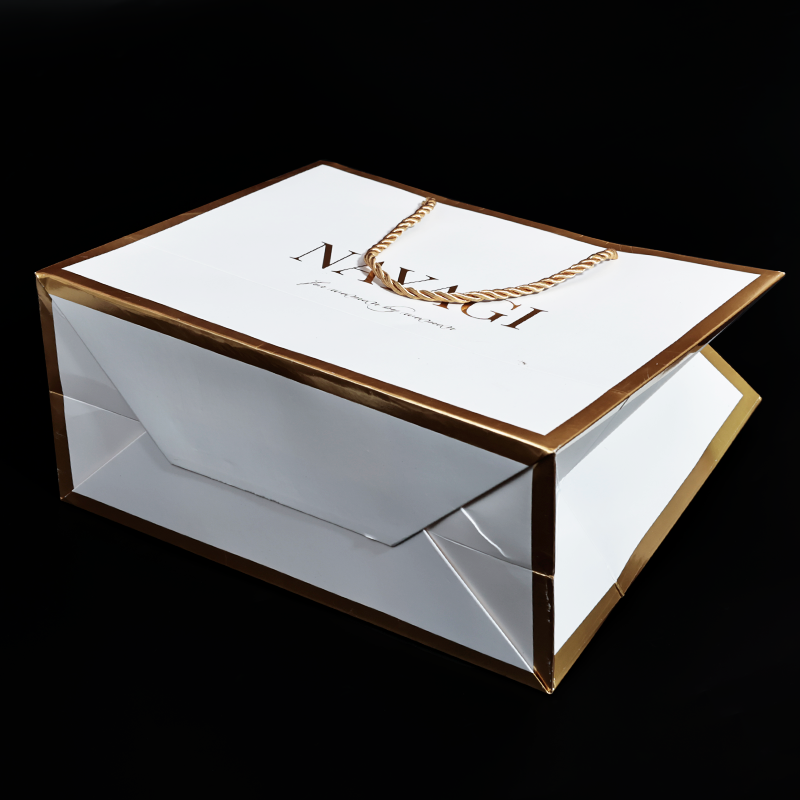 White pattern gold stamped paper bag with gold around the edges
