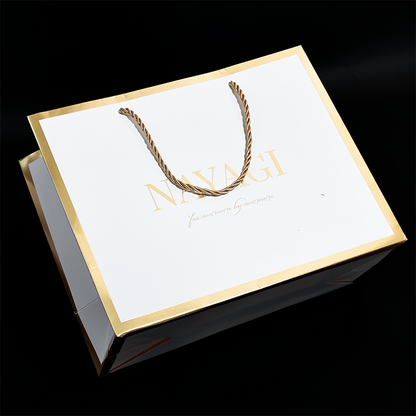 White pattern gold stamped paper bag with gold around the edges
