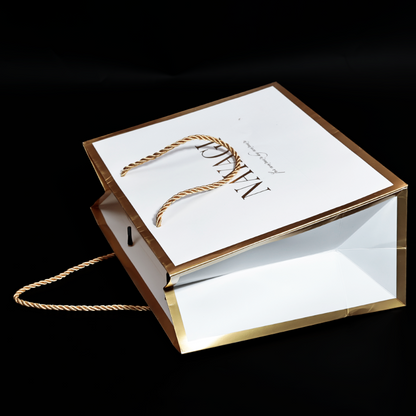 White pattern gold stamped paper bag with gold around the edges