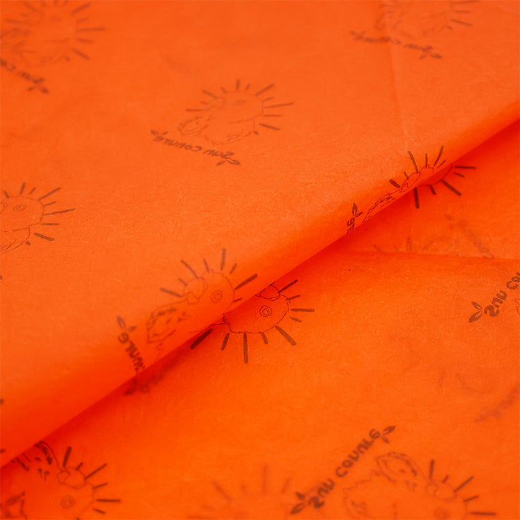 Orange wrapping paper pattern printed with gold